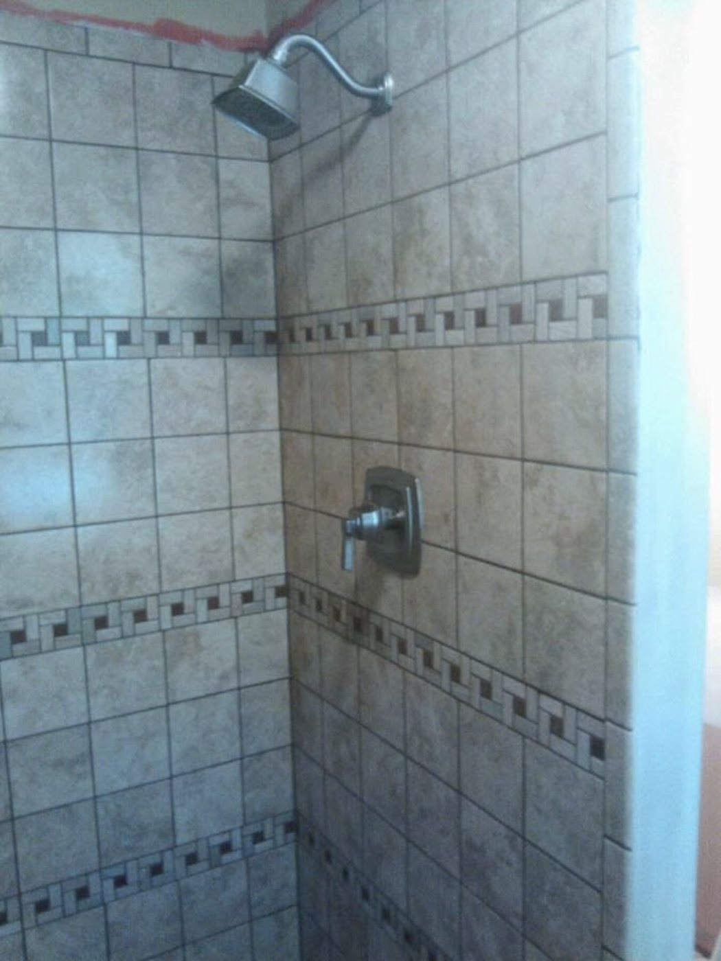 Custom shower tile and fixture installation