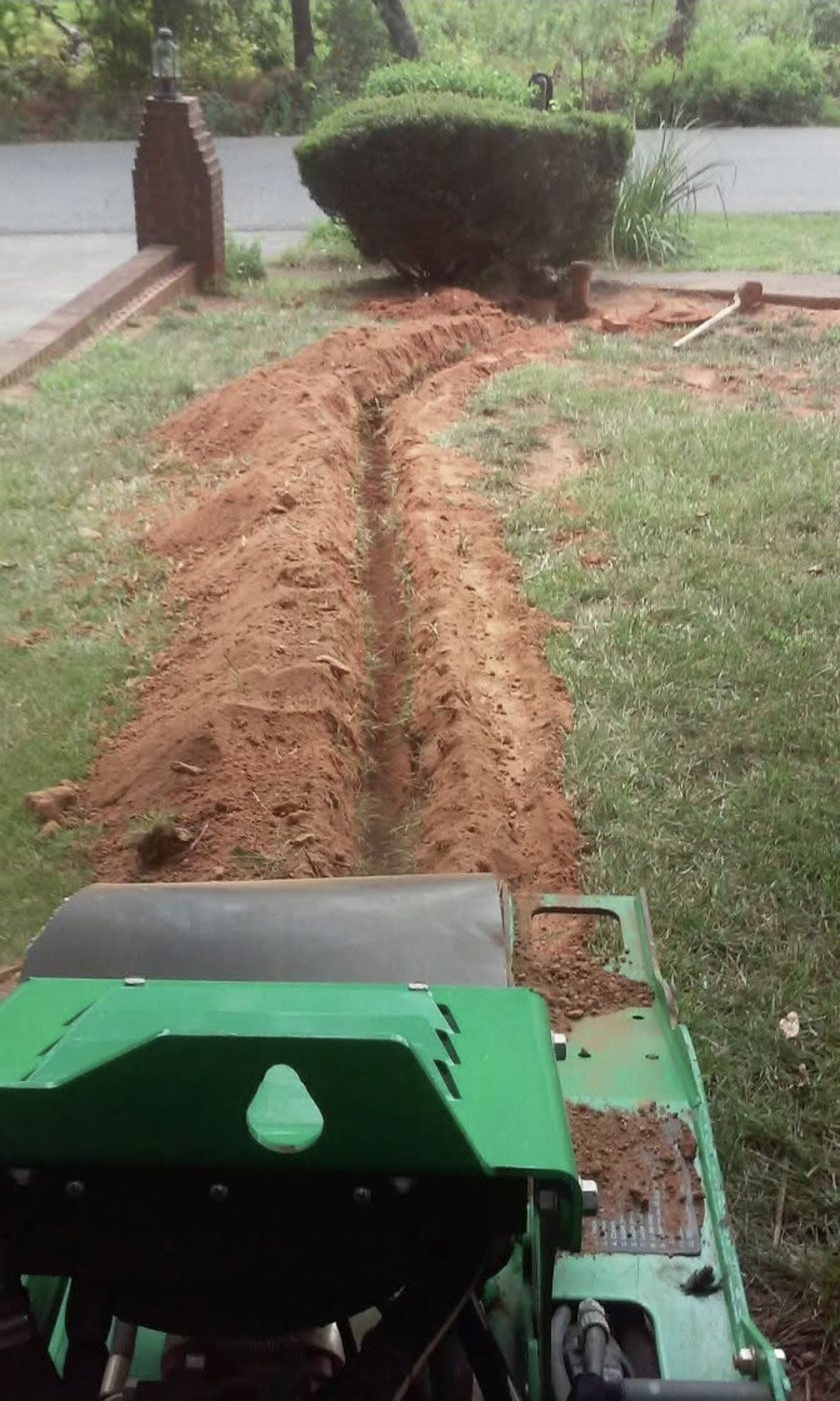 Professional trenching equipment used for water line repair